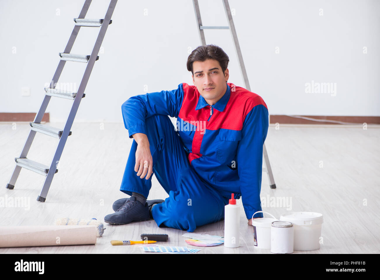 Young painter trying to match colours for painting job Stock Photo Alamy