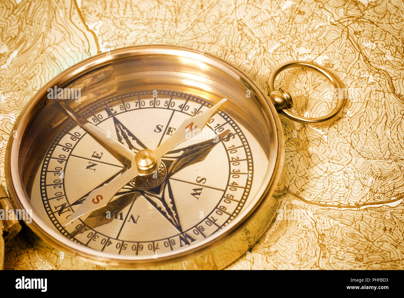 Golden compass on old map Stock Photo