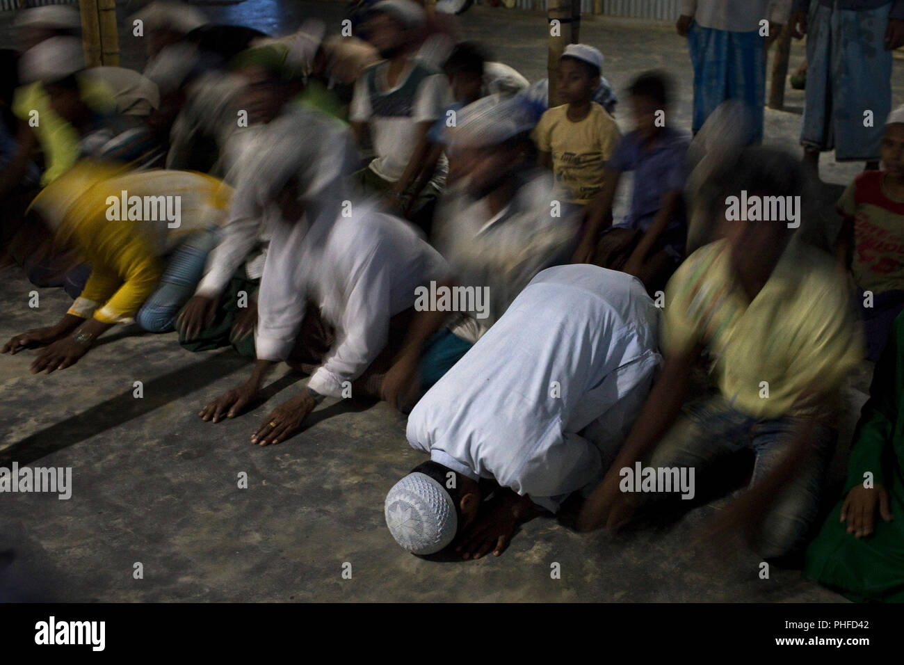 Men pray in a mosque in Balukhali, a part of the camp sheltering over 800,000 refugees, Cox's Bazar, Bangladesh, July 6, 2018 Stock Photo