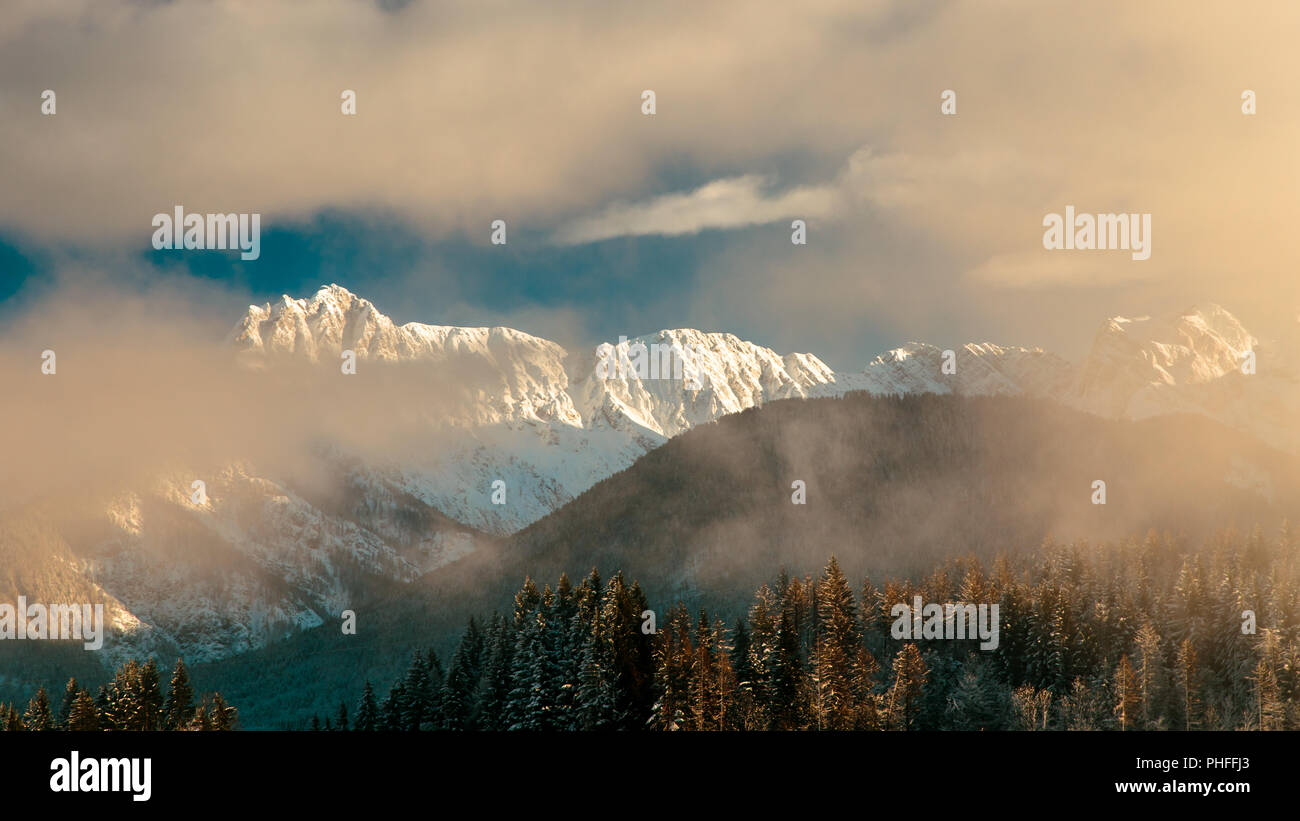 Clouds surrounding the italian alps after the snowfall Stock Photo - Alamy