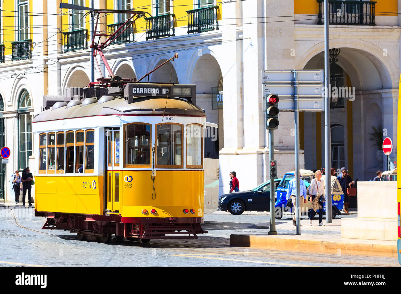 Lisbon, Portugal - March 27, 2018: Yellow tram, symbol of Lisbon and downtown square Stock Photo