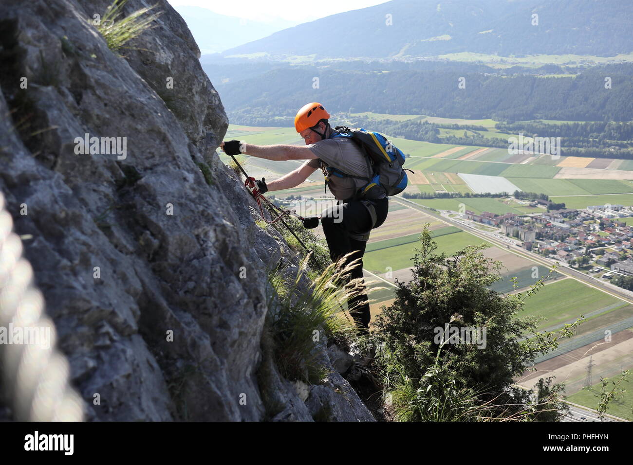 Sport climbing man on rock wall Stock Photo
