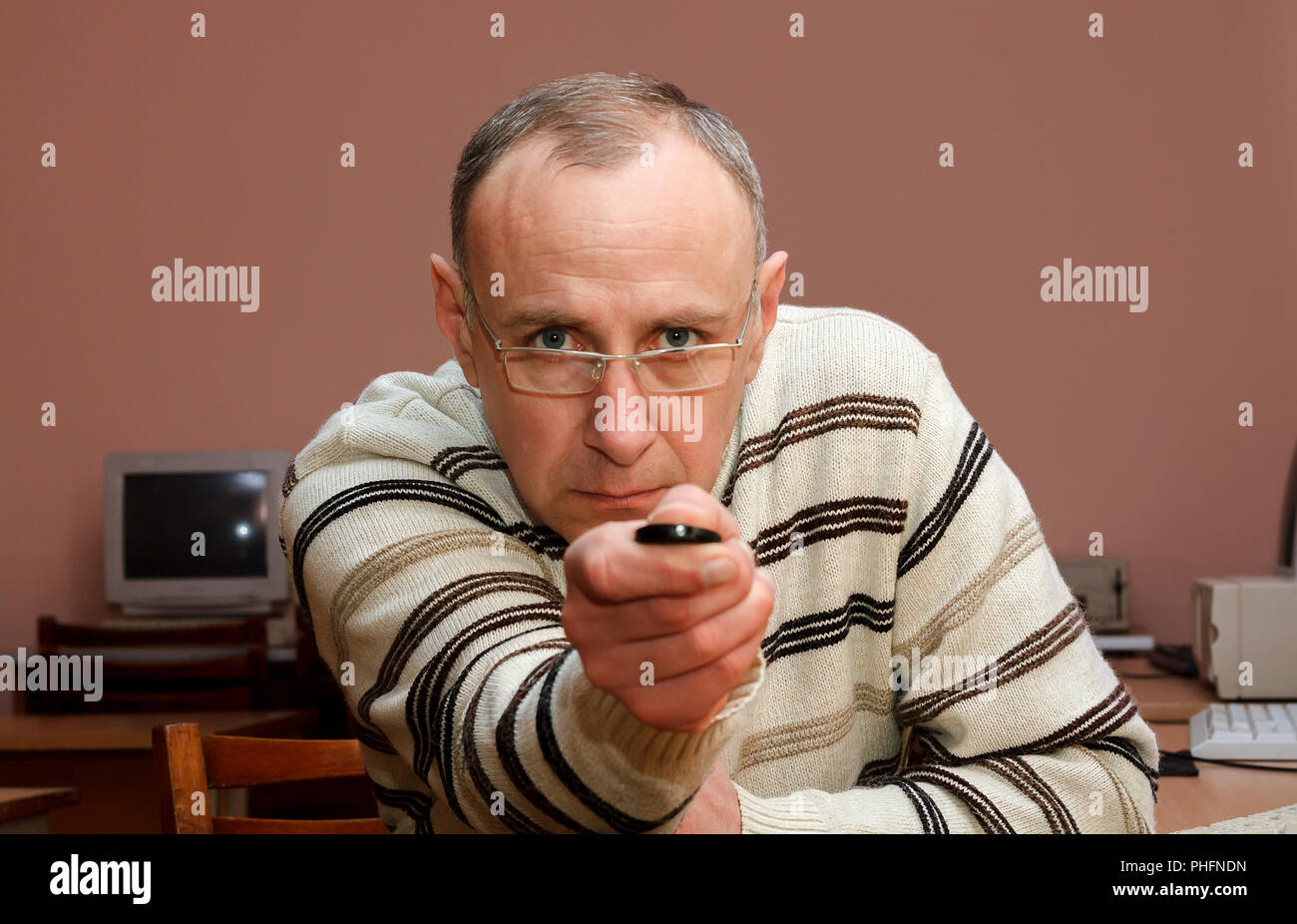 Man with remote control Stock Photo