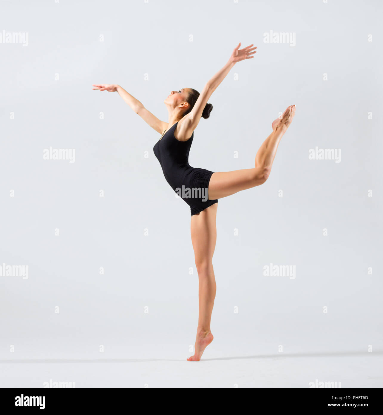 Young ballerina (on grey version) Stock Photo