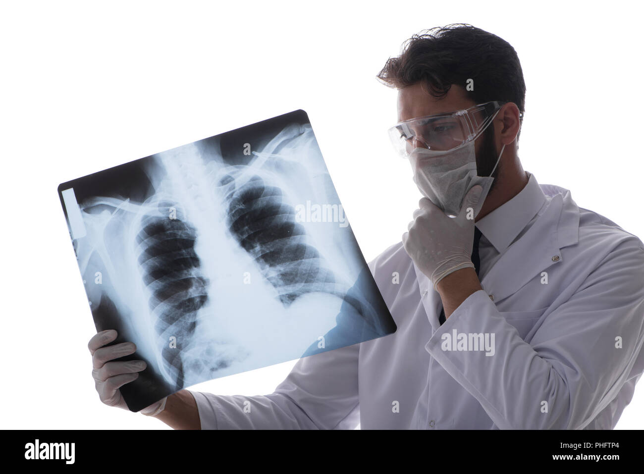 Young doctor looking at x-ray images isolated on white Stock Photo - Alamy