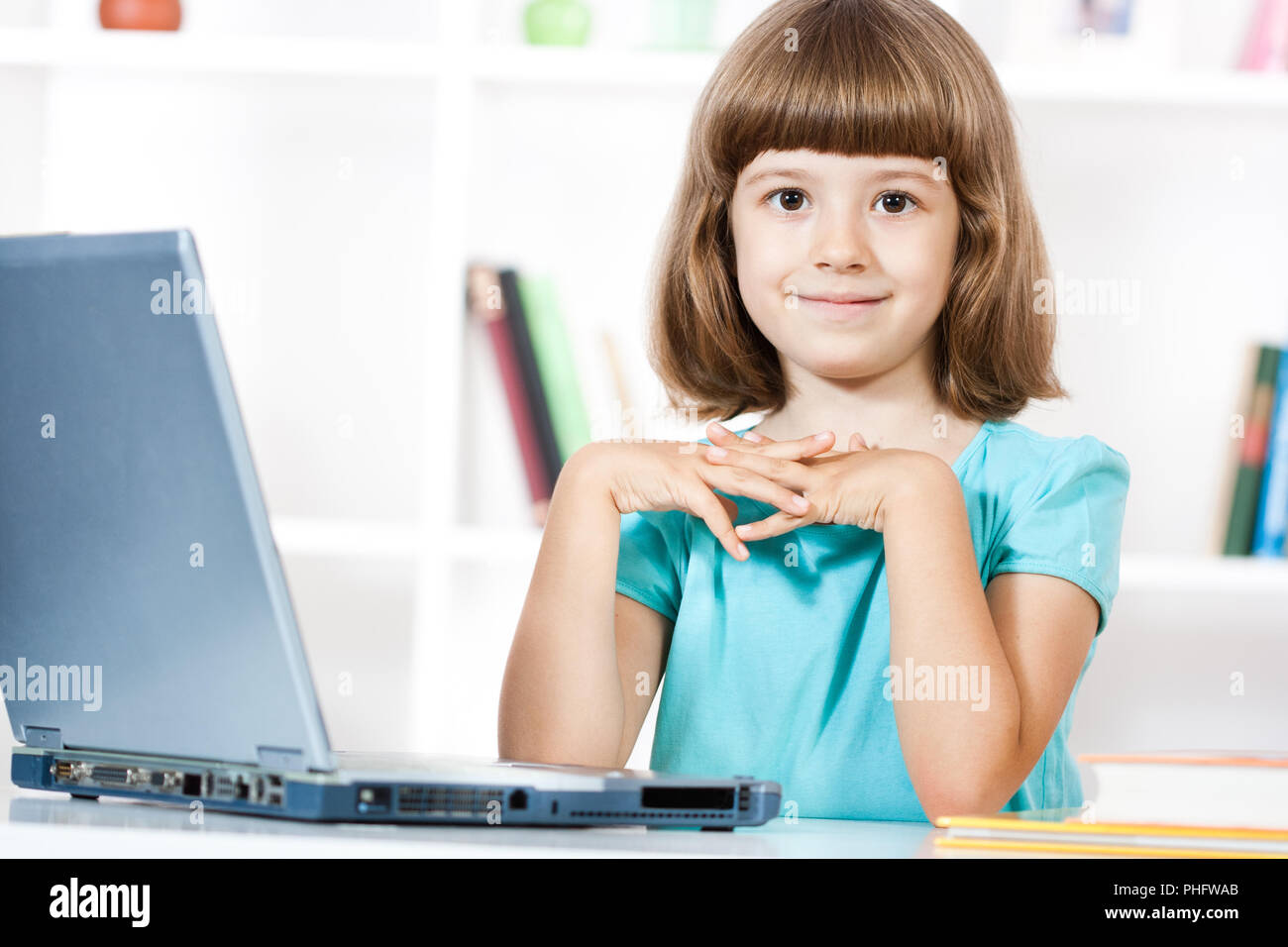 Little girl using laptop Stock Photo - Alamy