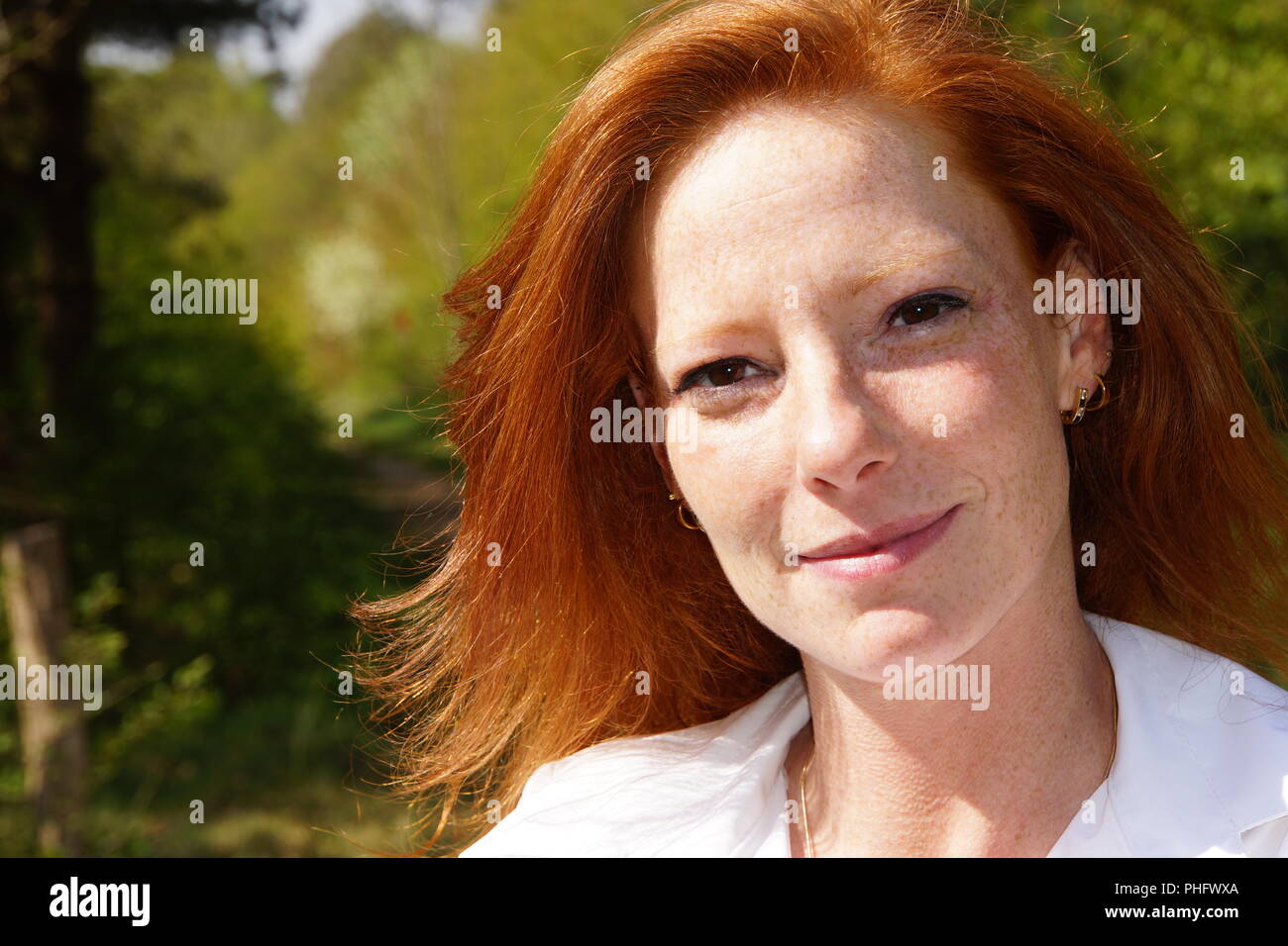 Portrait of a young red-haired woman Stock Photo - Alamy