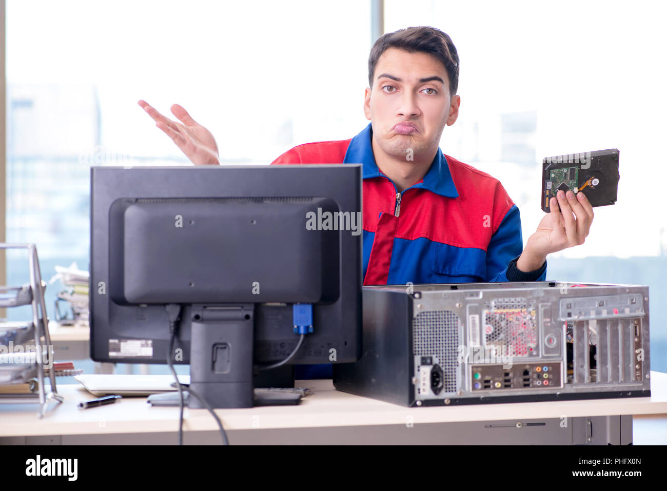 Data restoration specialist repairing corrupt hard drive Stock Photo
