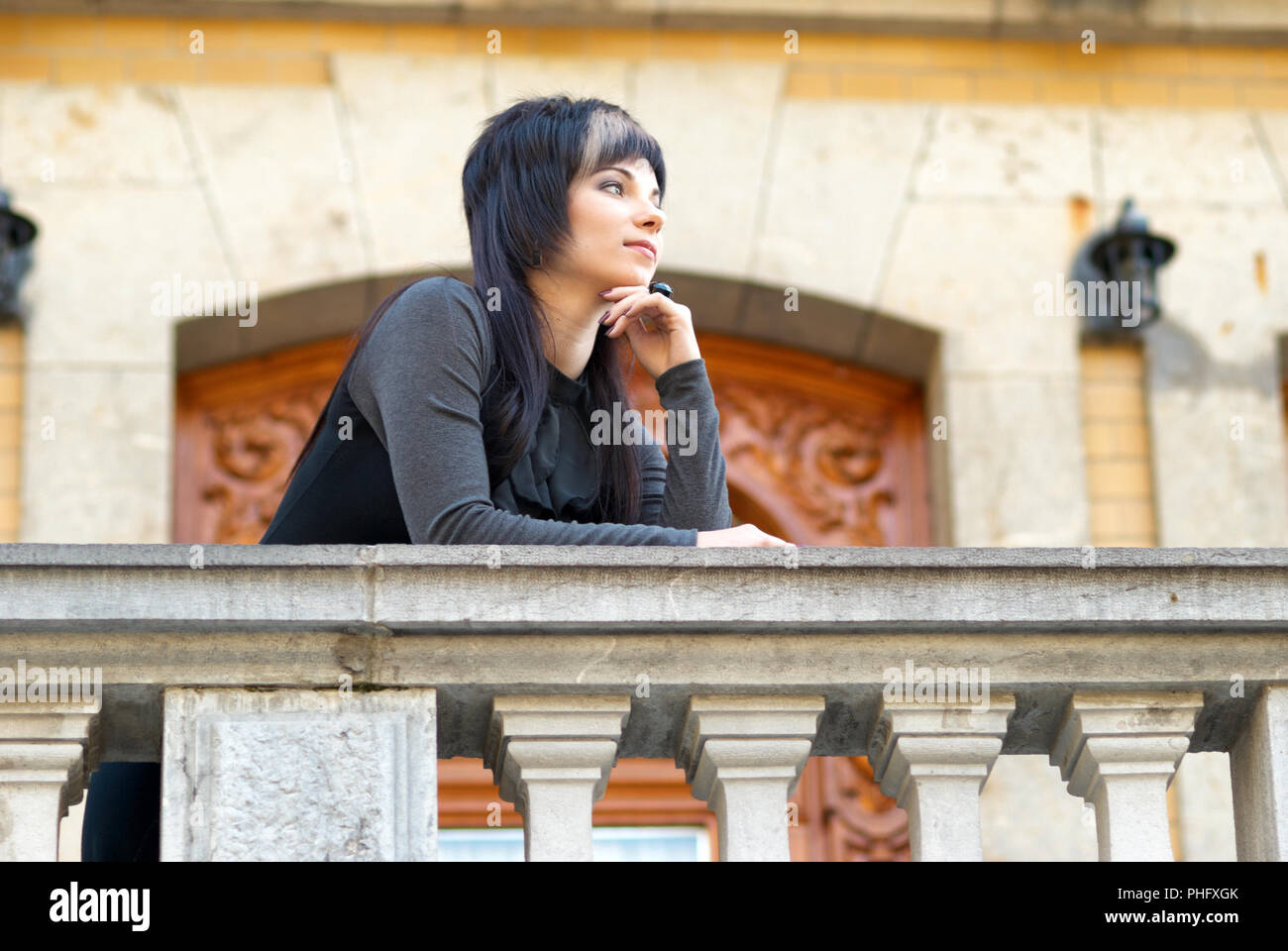 Pretty Woman In Black Dress On The Balcony Stock Photo Alamy