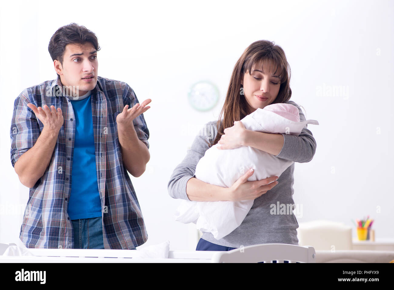 Young dad cannot stand baby crying Stock Photo - Alamy