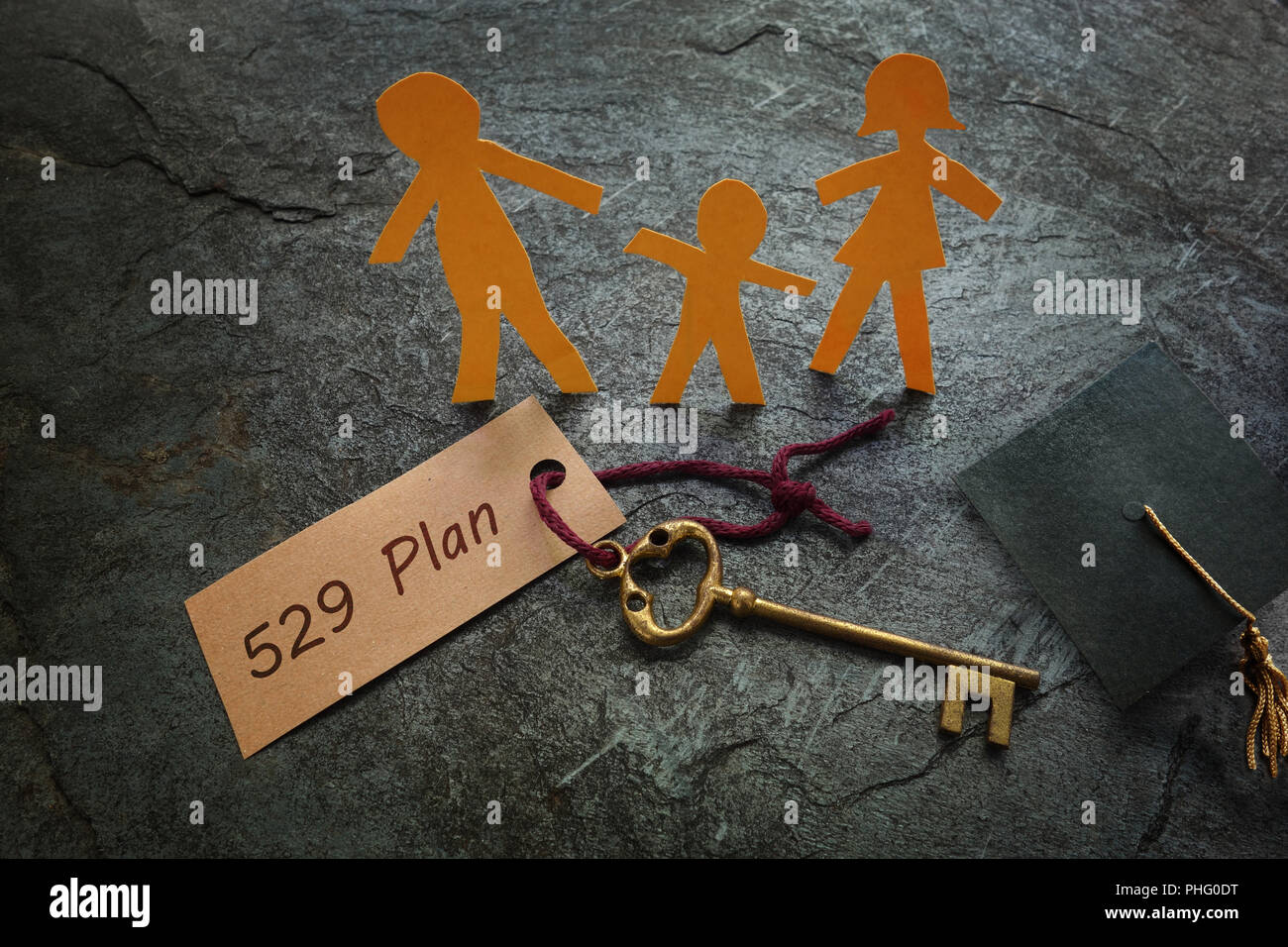 Paper family with 529 Plan gold key Stock Photo