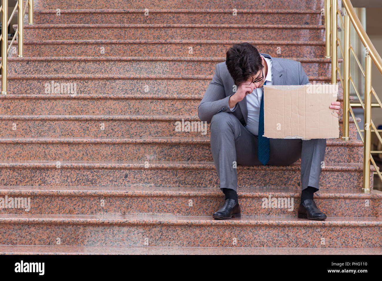 Desperate businessman begging on the street Stock Photo Alamy