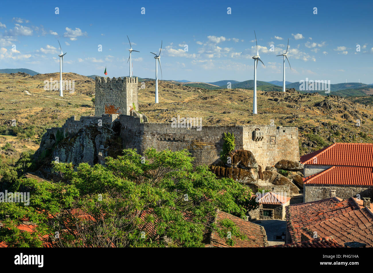 View of Sortelha castle, in Portugal, with energy windmill in background. Stock Photo
