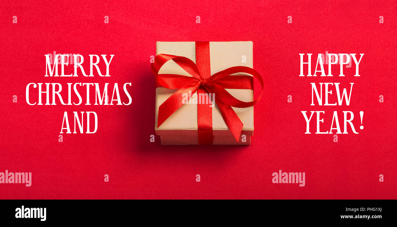 Gift kraft square box with a red ribbon on a red background Stock Photo ...