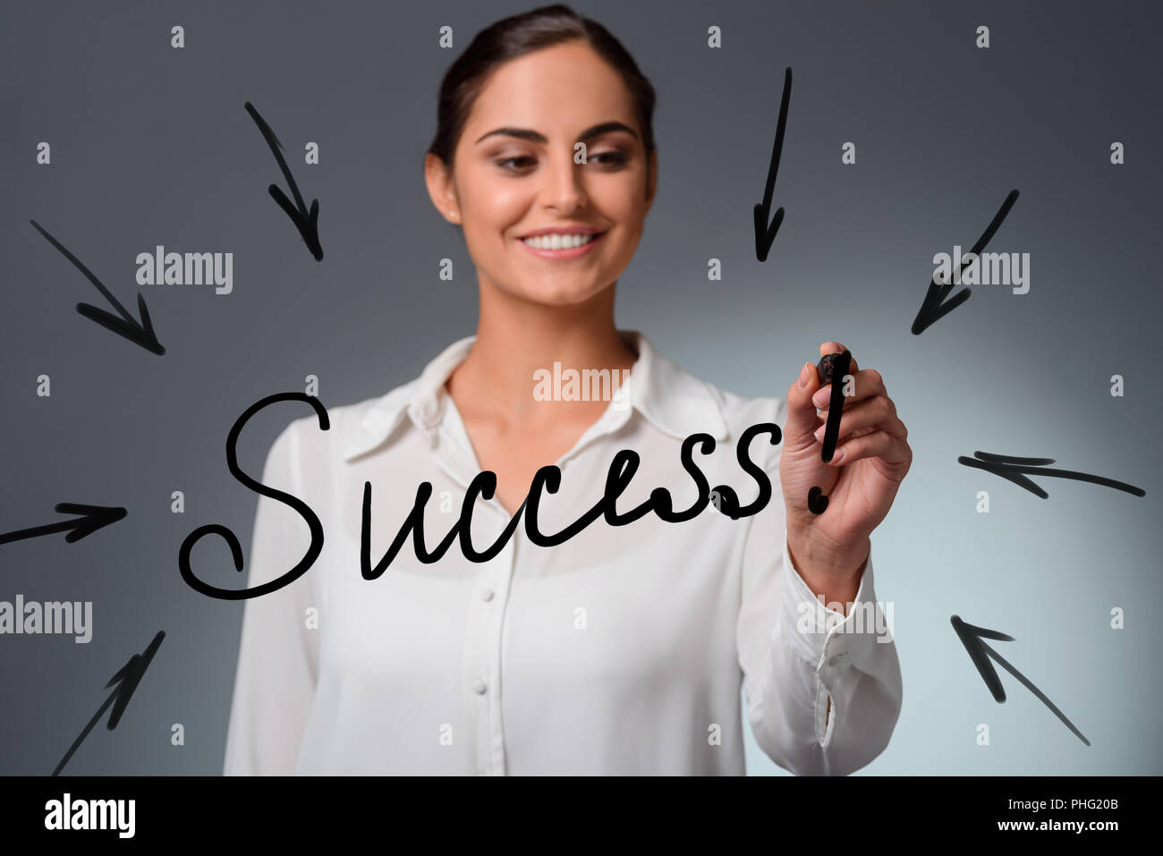 Woman draws 'Success' lettering Stock Photo