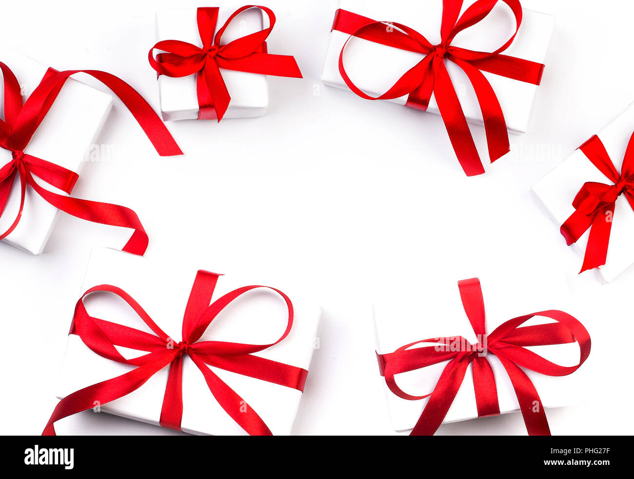 White gift box with red ribbon on white background Stock Photo - Alamy