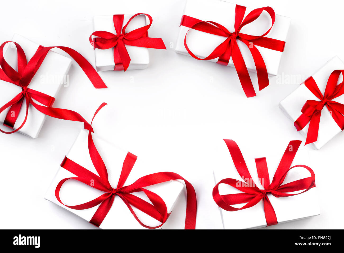 White gift box with red ribbon on white background Stock Photo - Alamy