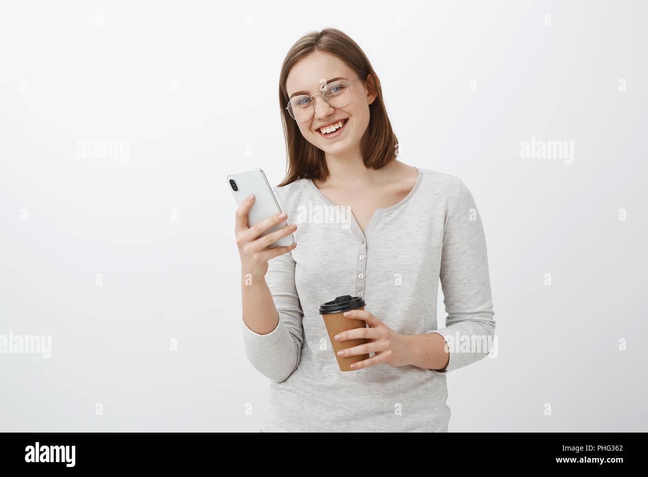Friendly Looking Enthusiastic Caucasian Girl In Glasses With Brown