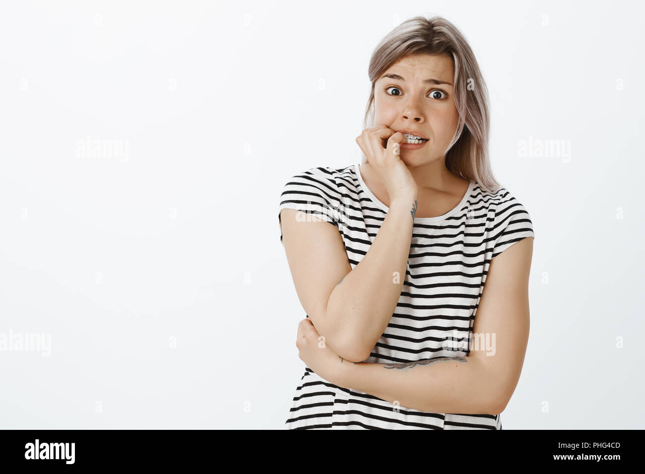 What if he knows it was me. Shocked nervous girlfriend in striped t