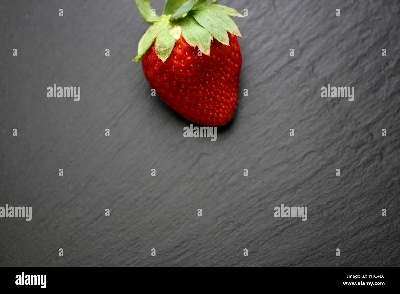 Strawberry on slate plate Stock Photo
