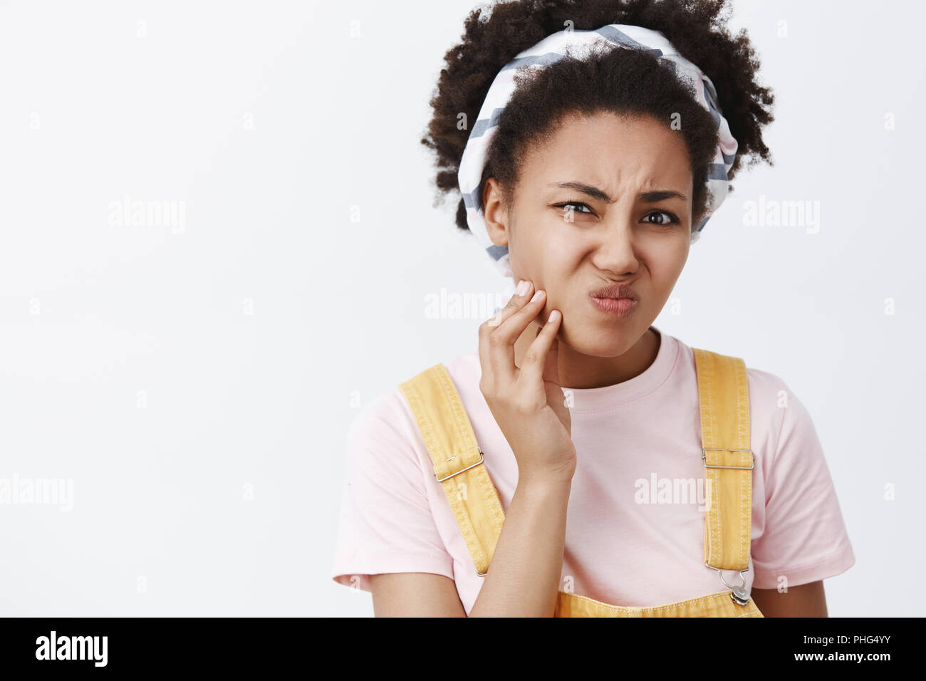 Gosh not acne again. Displeased unhappy cute female having problems