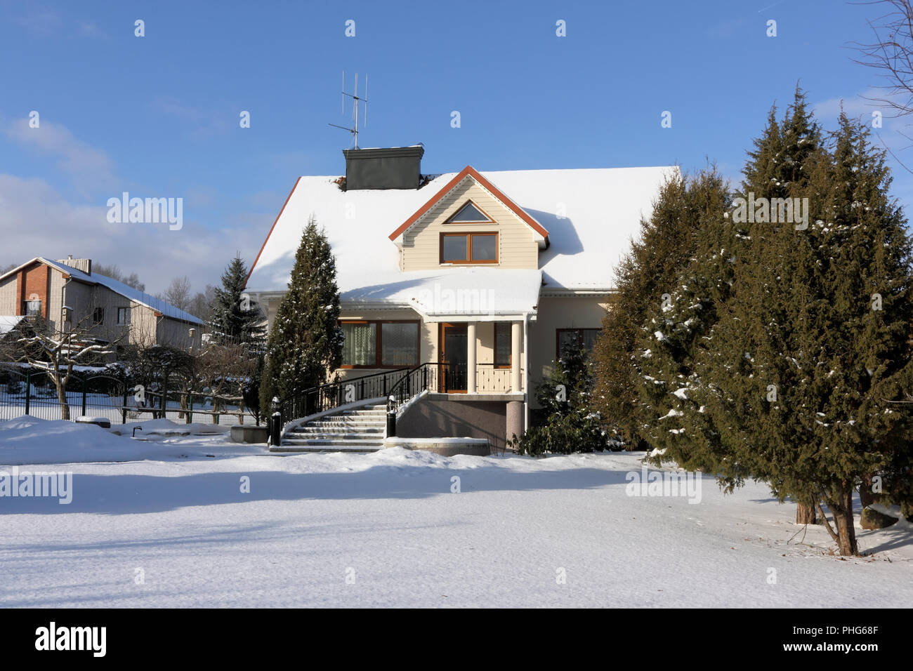 house and garden in snow Stock Photo