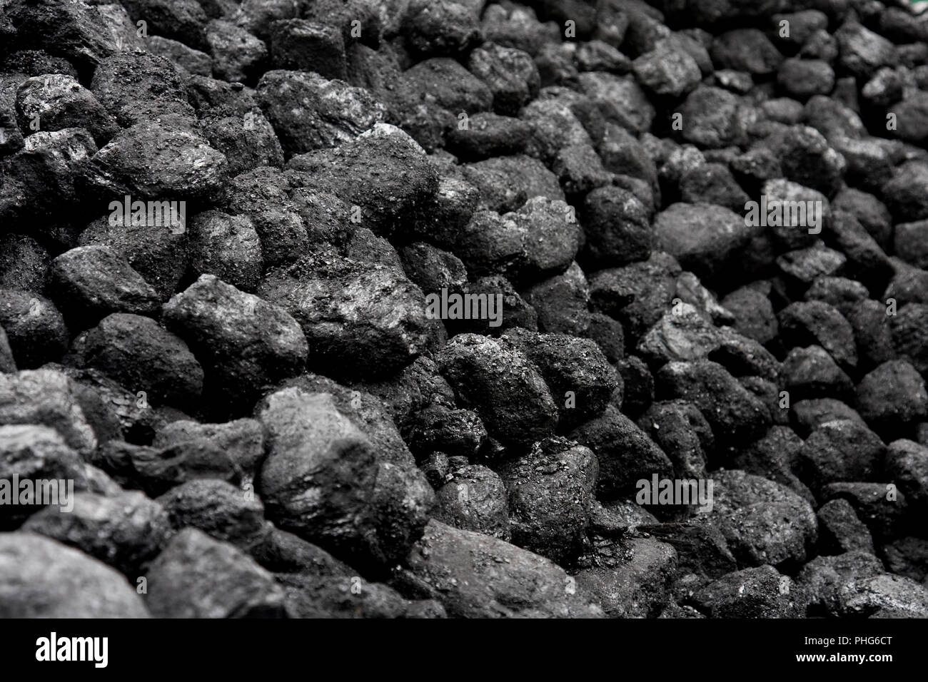Close up, full frame view of lumps of unburnt black coal on a pile. This source of energy was sourced from pits around the UK. Stock Photo
