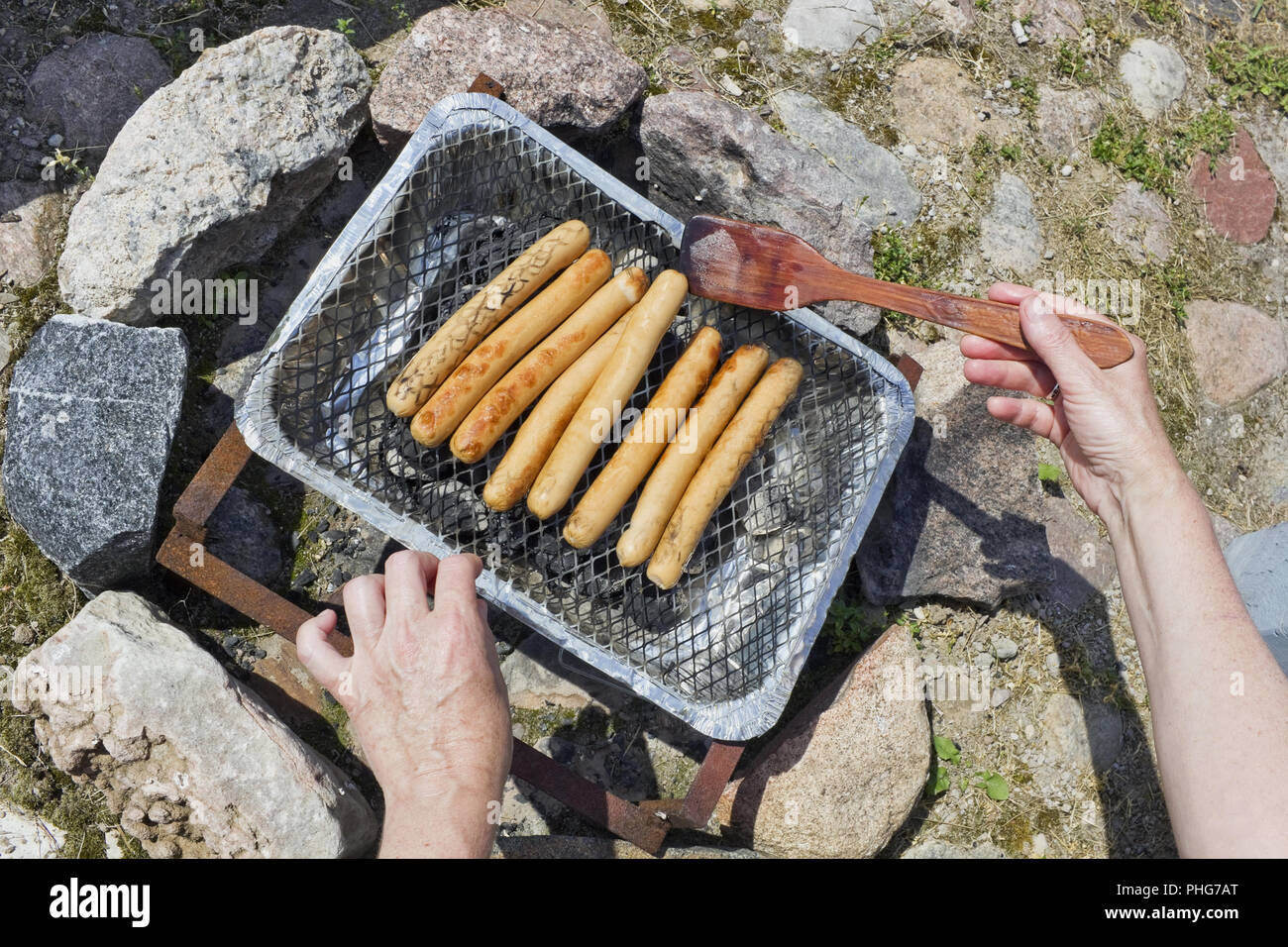 Process of frying of pork sausage Stock Photo