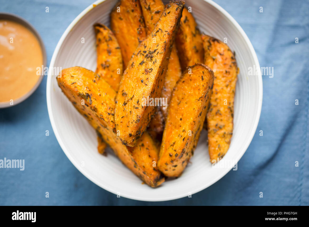Sweet potato wedges with chilli mayo dip Stock Photo