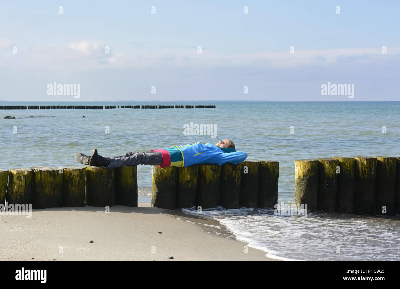 little girl lying on the beach Stock Photo Alamy