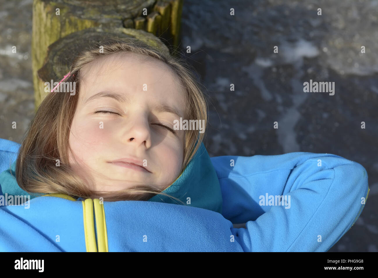 little girl sleeping on the beach Stock Photo Alamy
