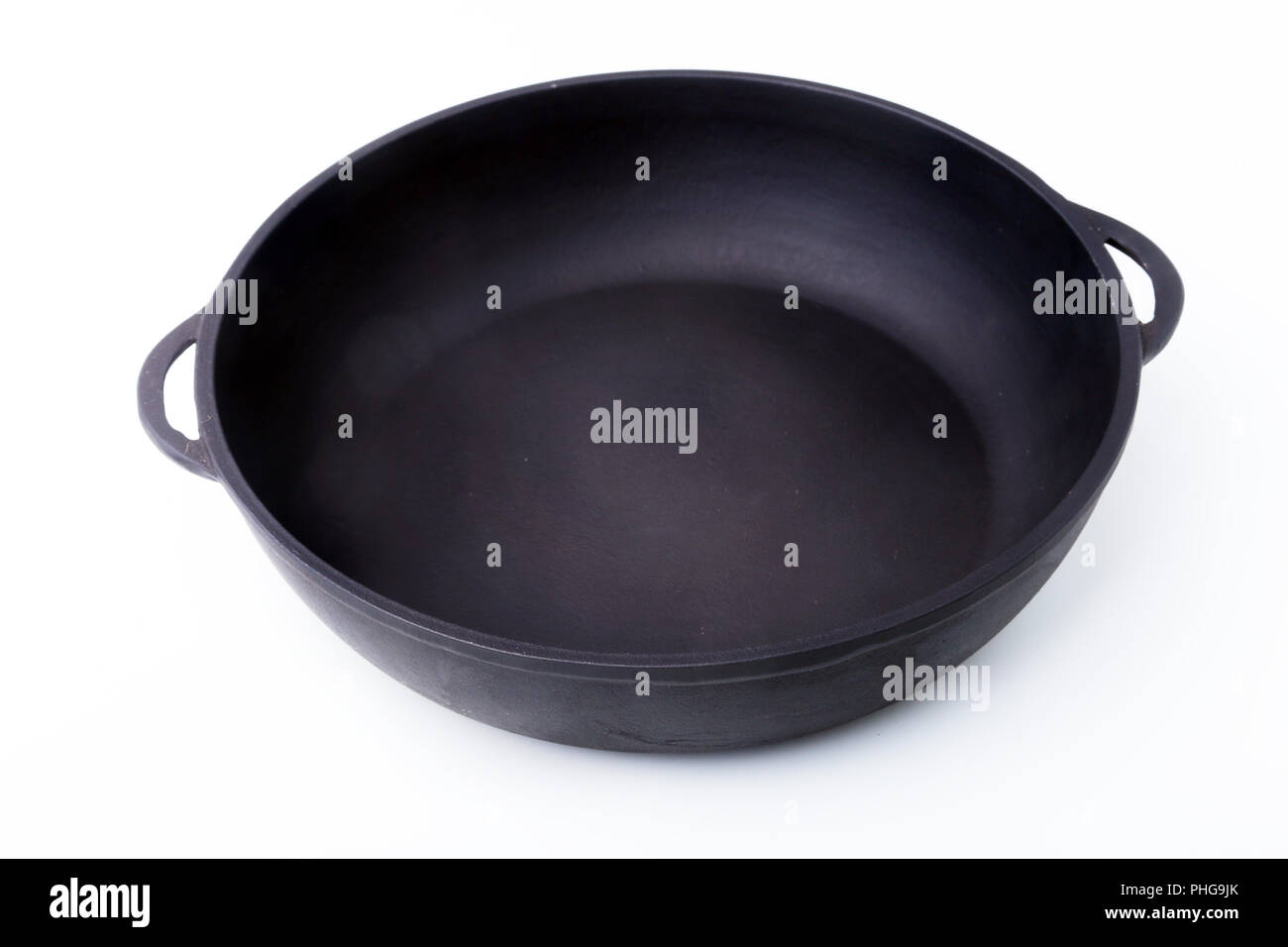 A new, clean and empty castiron pan for the grill Stock Photo Alamy