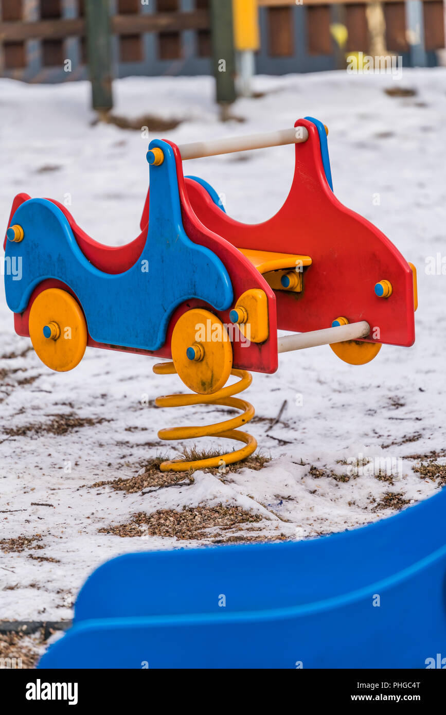 Colorful car swing on a children playground Stock Photo Alamy