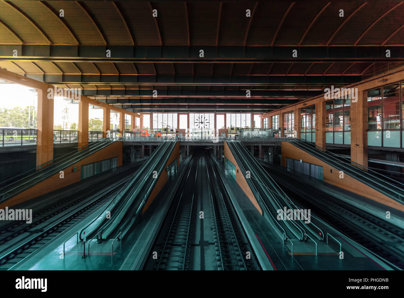 Central Train Station With Train Tracks And Escalators In Front