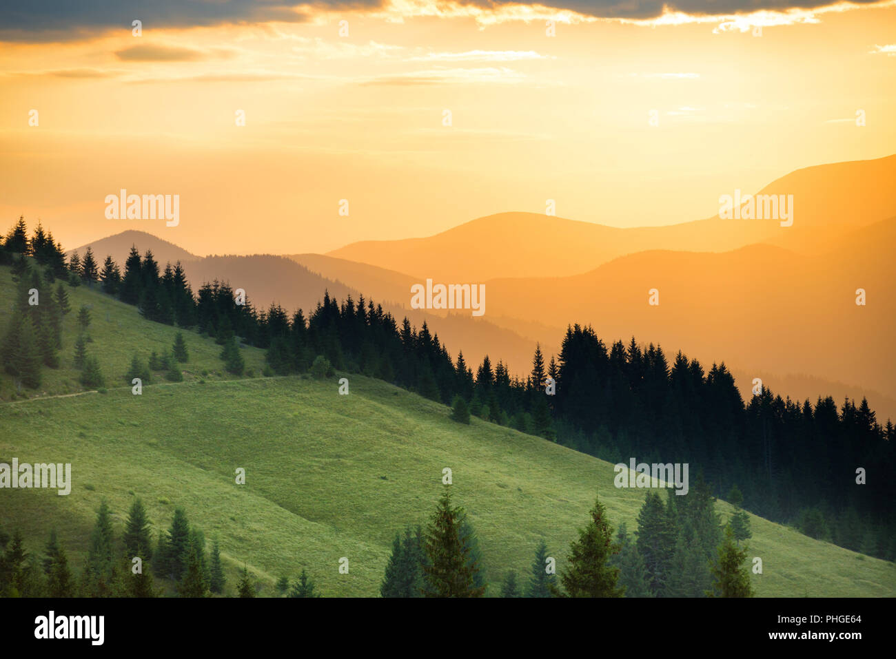 Beautiful sunset in the mountains Stock Photo - Alamy