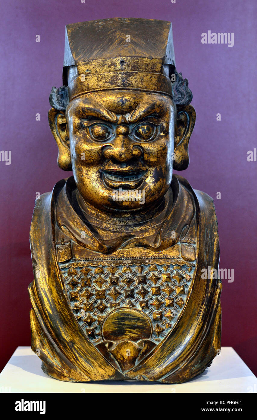 Gilt-bronze head of Buddhist guardian figure. Chinese, Yuan Dynasty (1300-50) British Museum, Bloomsbury, London, England, UK. Stock Photo