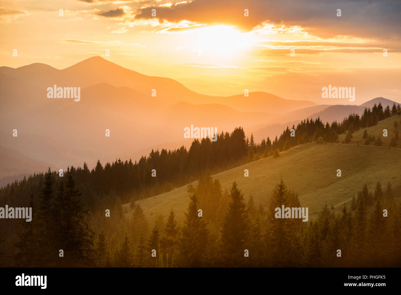 Beautiful sunset in the mountains Stock Photo - Alamy