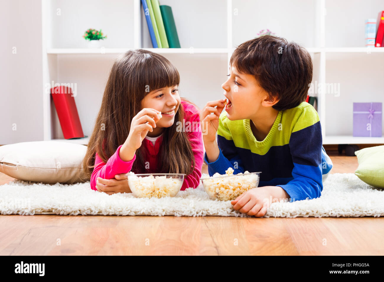 Children eating popcorn Stock Photo Alamy