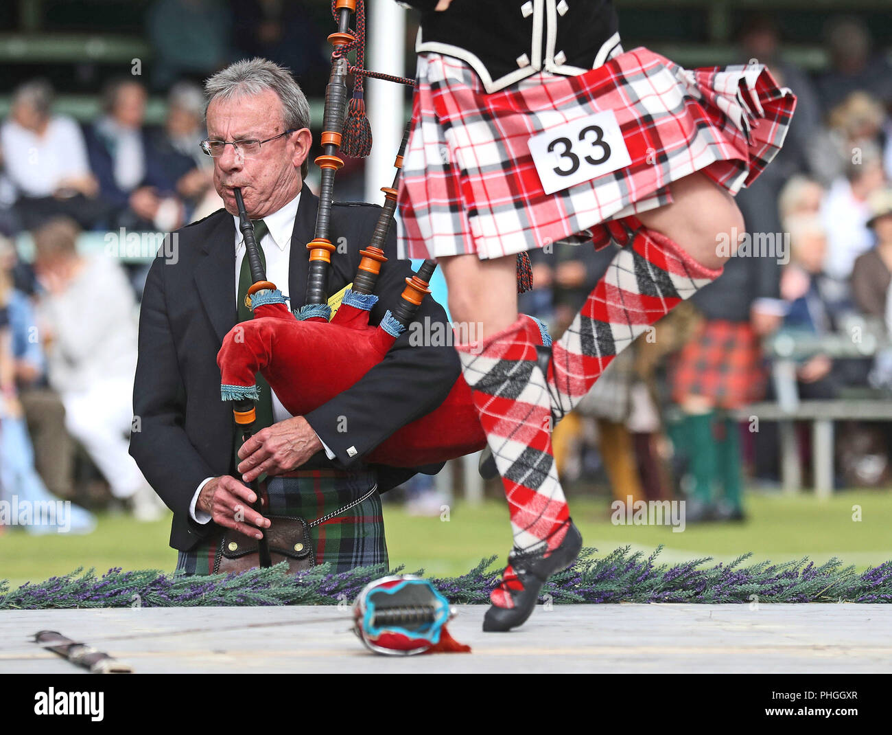 Bagpipes are played for highland dancers during the Braemar Royal Highland Gathering at the Princess Royal and Duke of Fife Memorial Park, Braemar. The Gathering has been run in its present form since 1832. Stock Photo