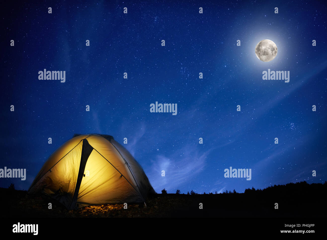 Illuminated orange camping tent Stock Photo Alamy