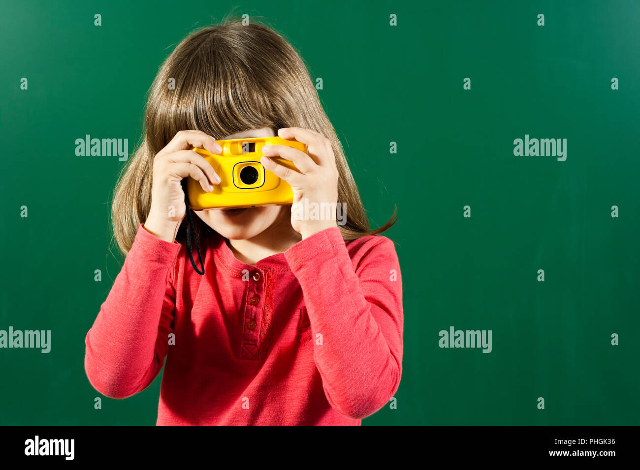 Little girl with photo camera Stock Photo