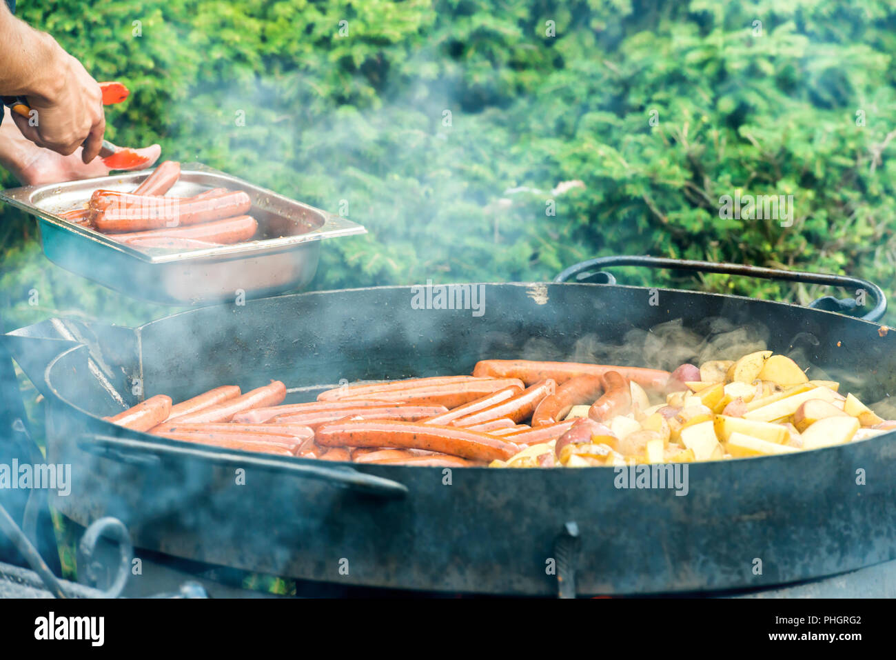Sausages cooking on the grill Stock Photo Alamy