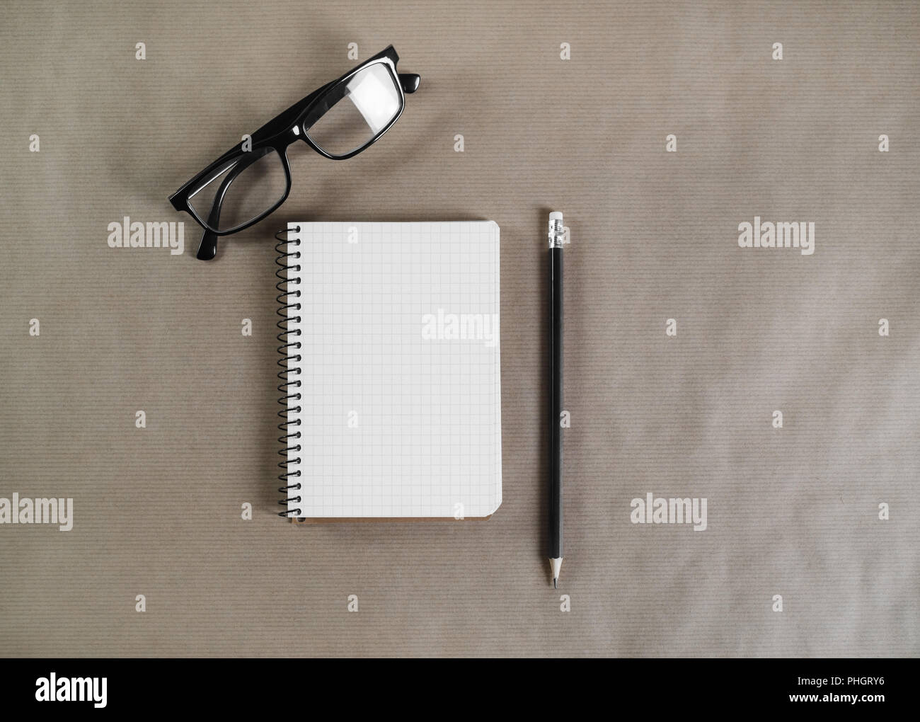 Notepad, glasses, pencil Stock Photo