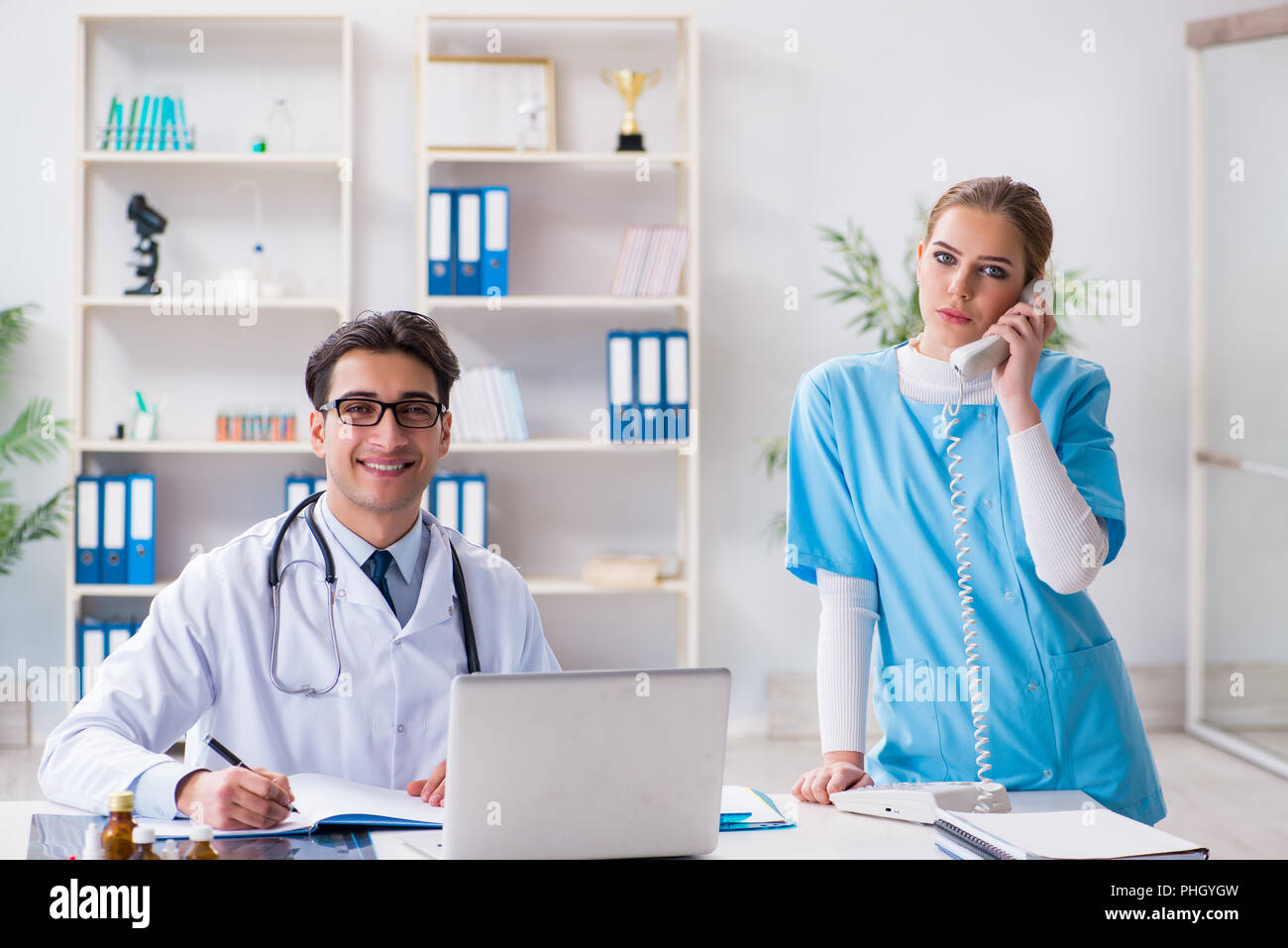 Male and female doctor having discussion in hospital Stock Photo - Alamy