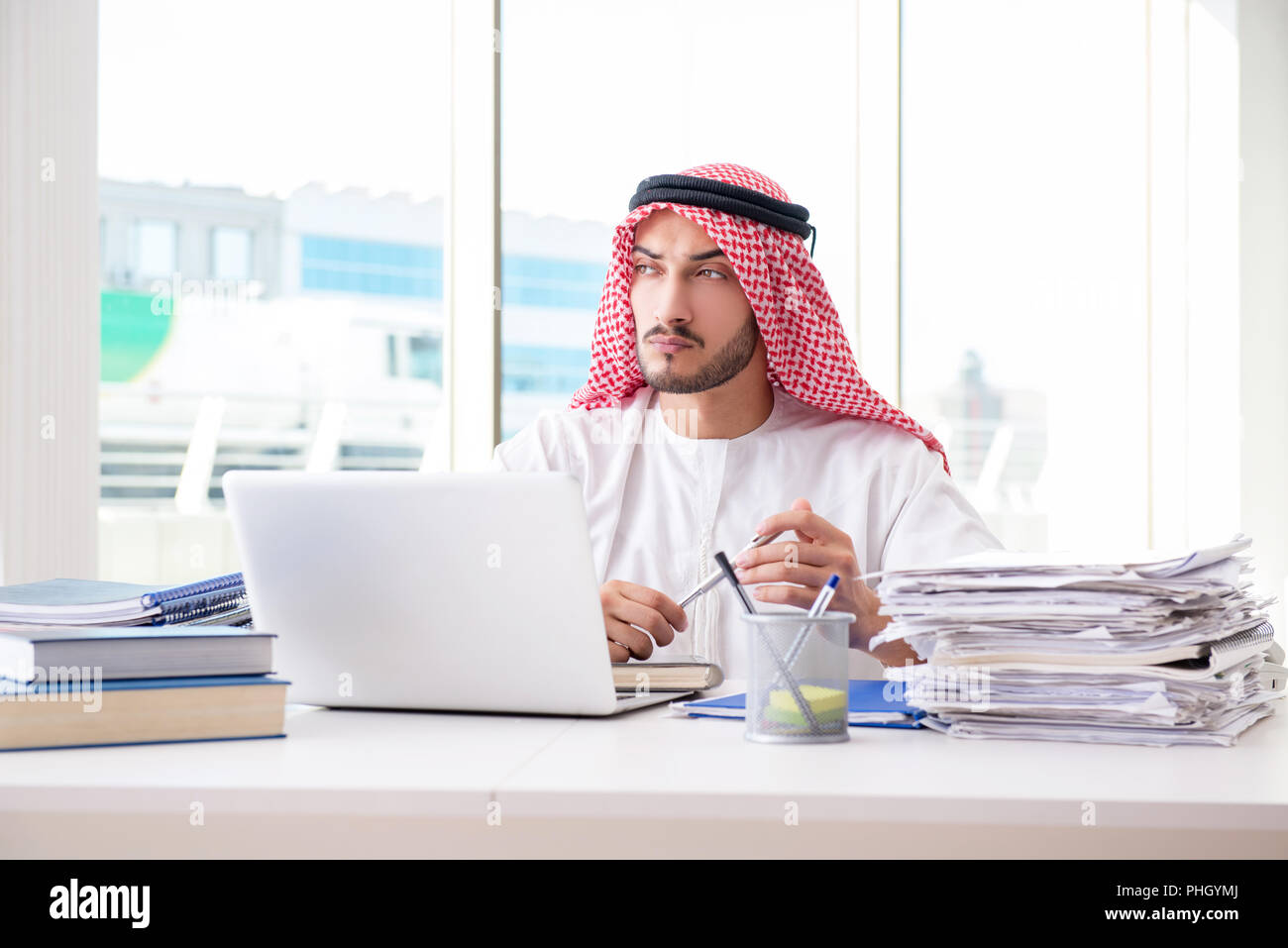 Arab businessman working in the office Stock Photo - Alamy