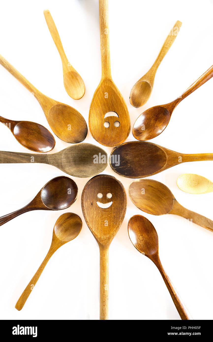 Wooden smiley face spoons on white background Stock Photo - Alamy