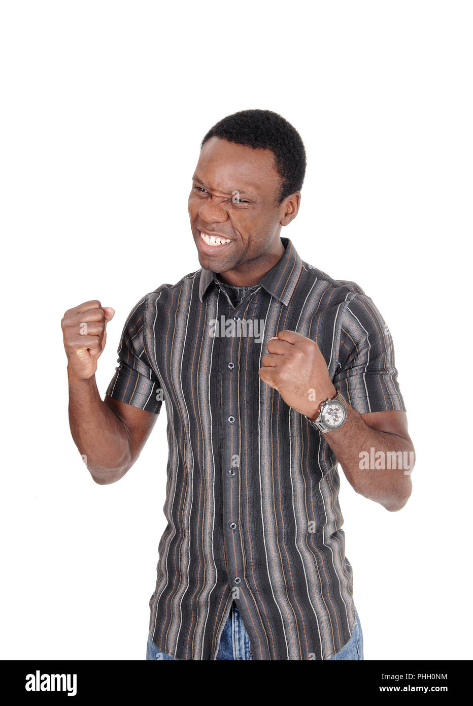 Happy African man making fists, smiling Stock Photo