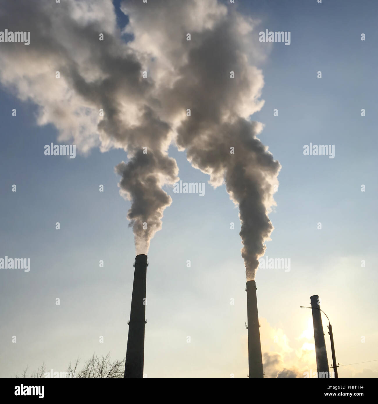 Smoke, pollution from factory pipes Stock Photo