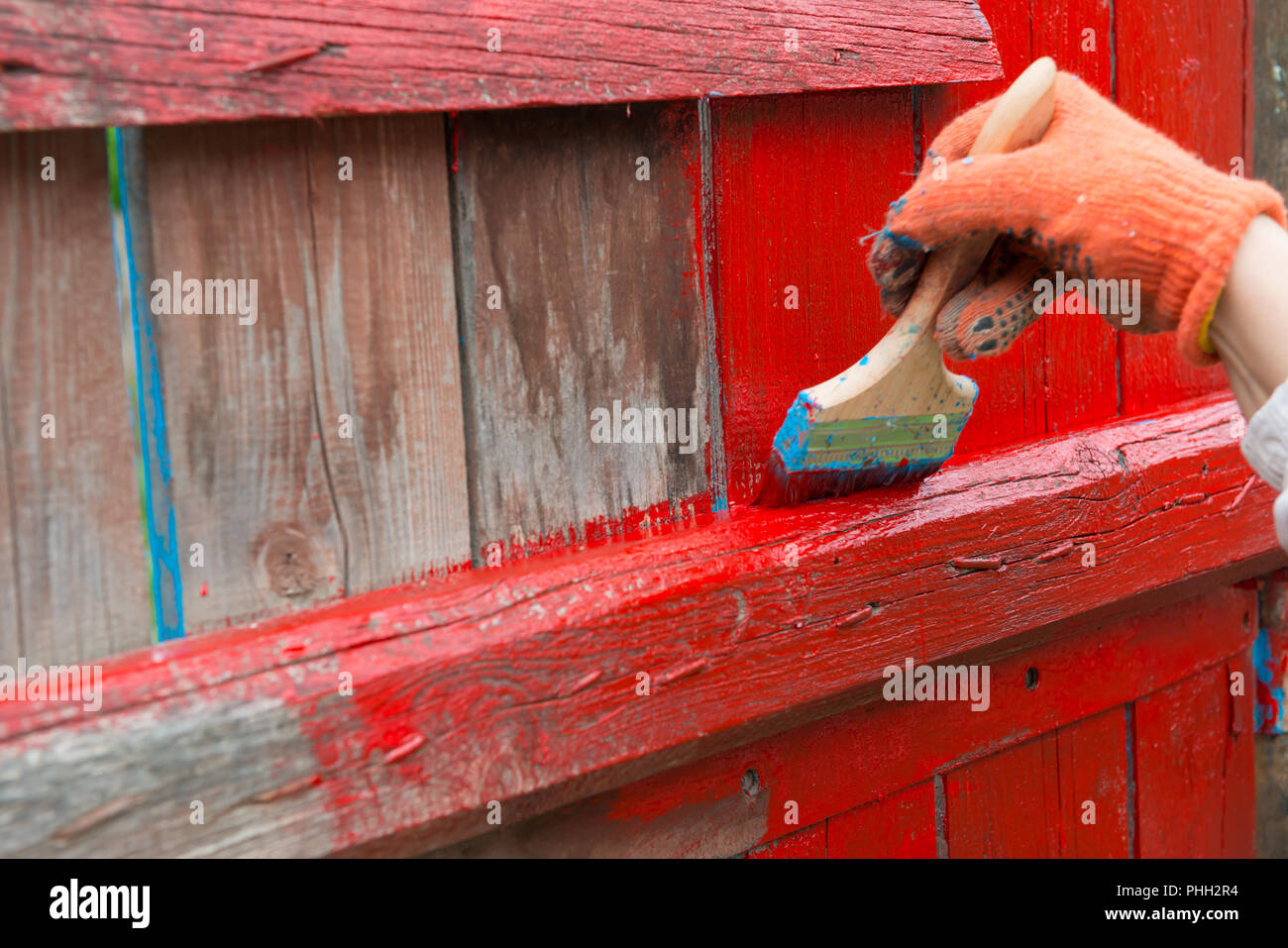 Man Painting a Wooden Picket Fence with Purple Wood Stain and Brush in a  Garden. Stock Photo - Image of natural, nailed: 182923494