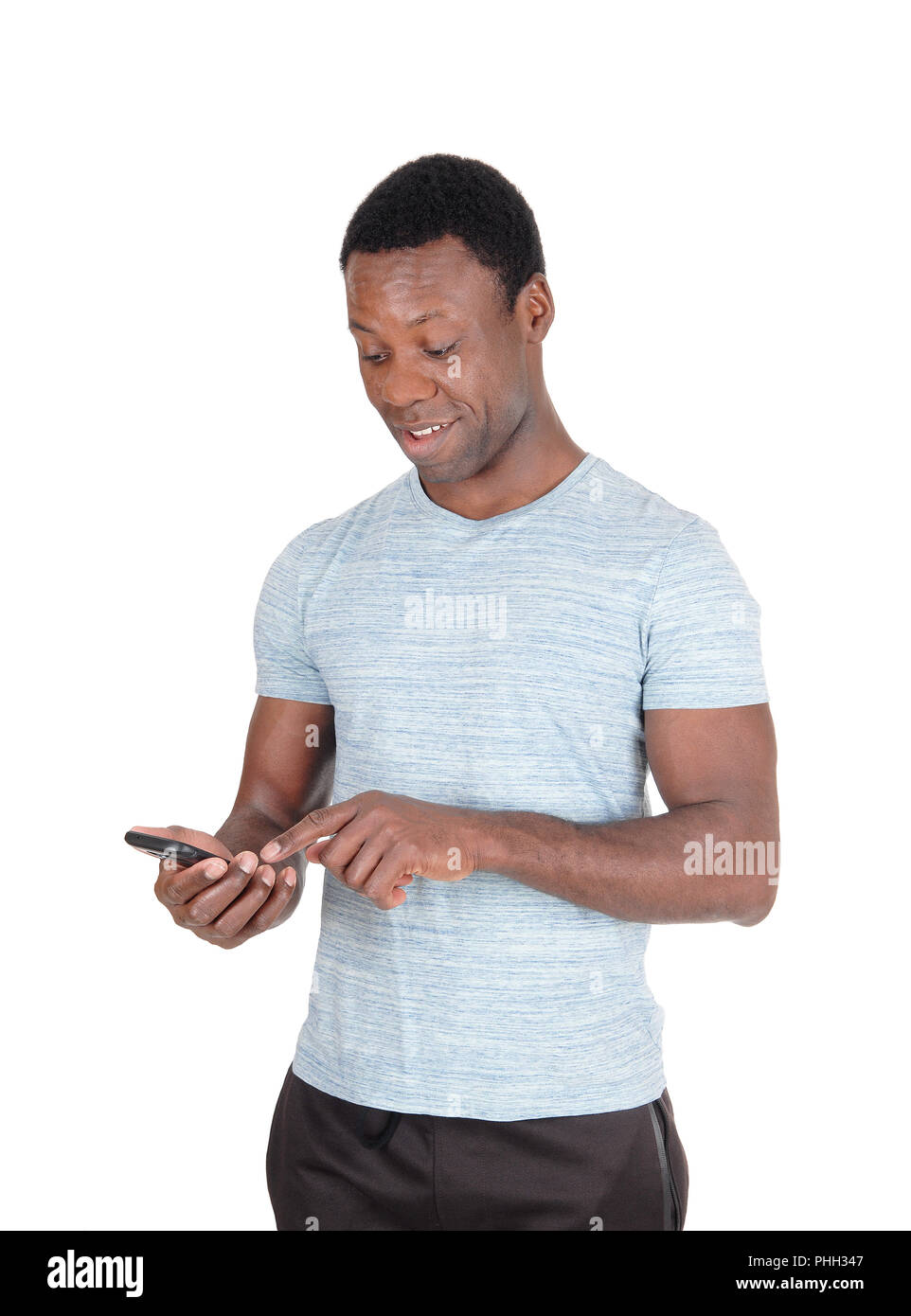 Man looking surprised at his phone Stock Photo